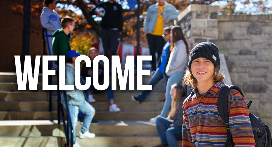 Welcome text overlaying image of one student smiling at the camera, with other students gathered behind on stairs